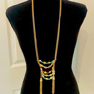 Top, gold necklace with turquoise